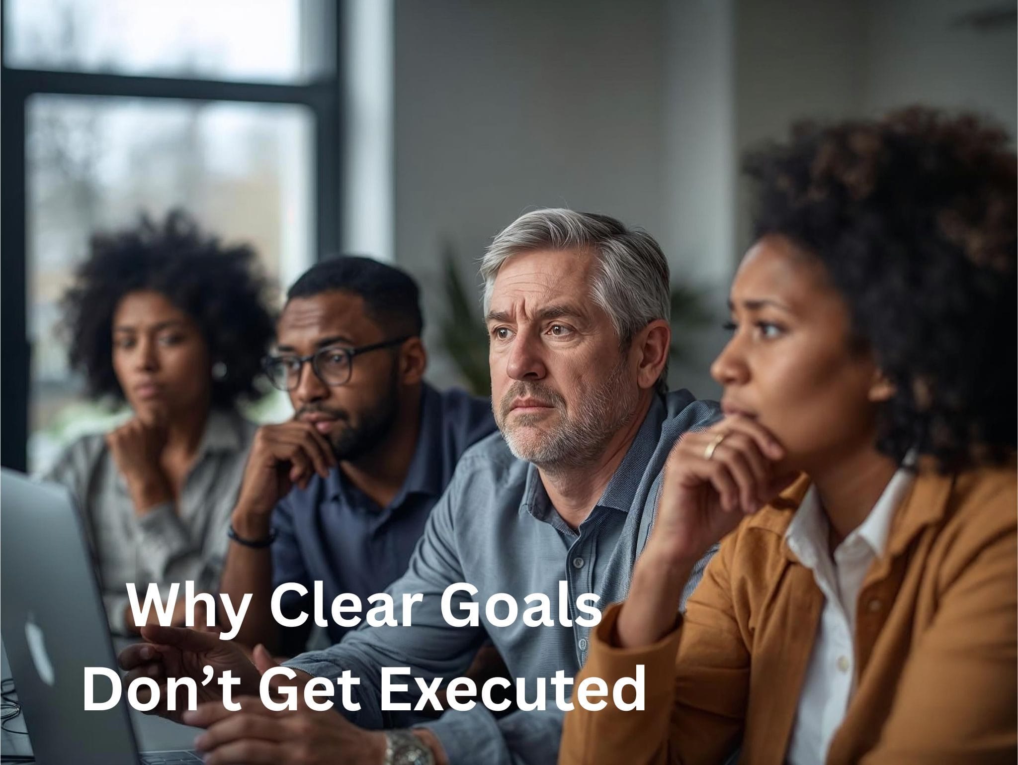 People from diverse backgrounds looking thoughtful in a professional setting, representing the challenge of turning clear goals into consistent execution
