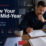 Review your goals mid-year with a focused professional resetting their plan for a stronger second half